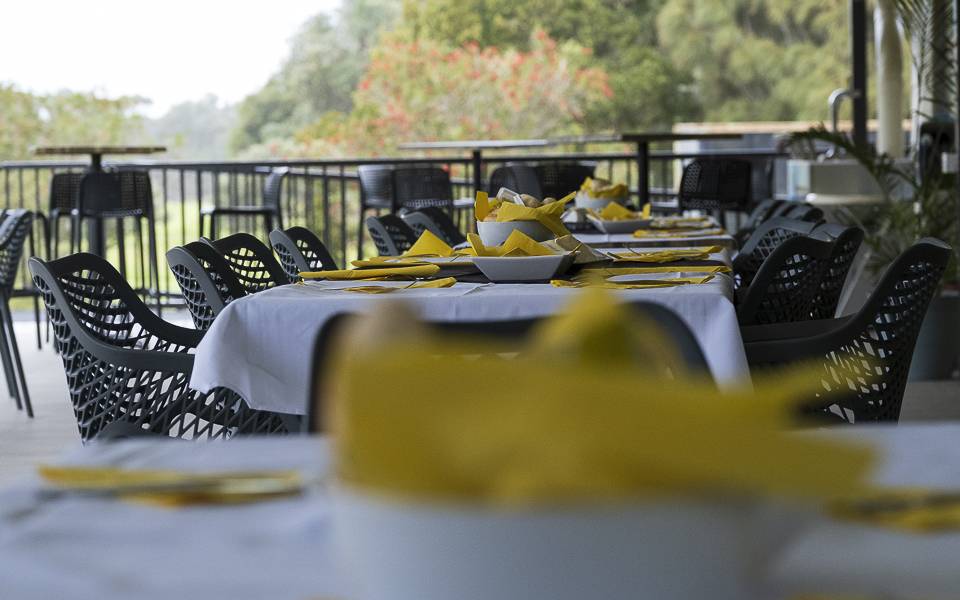 Outside dining area with tables set for function