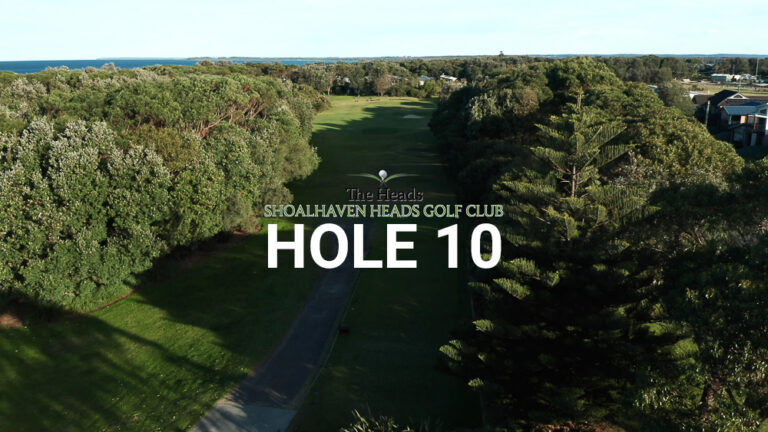 Hole 10 — Aerial view of the tree-lined fairway at The Heads, Shoalhaven Heads Golf Club, with native coastal bush framing the course and bush views in the distance.